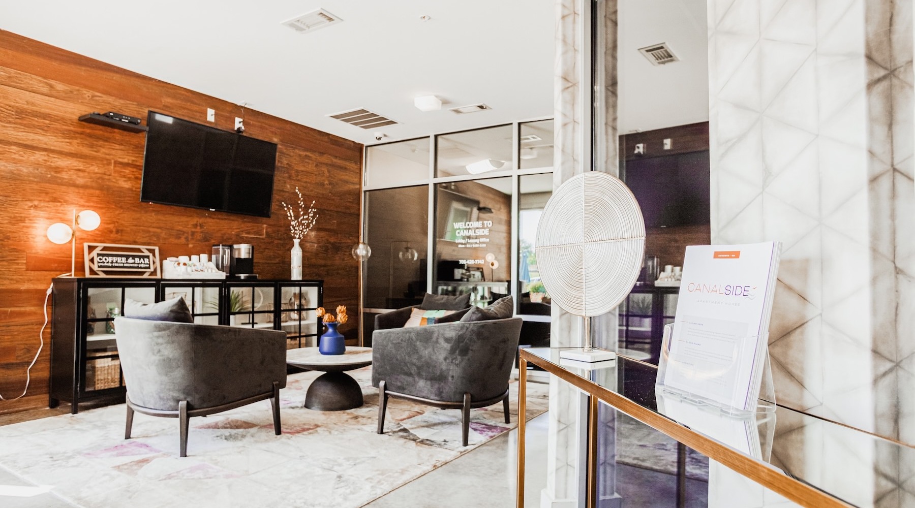 a clubroom with chairs and a tv