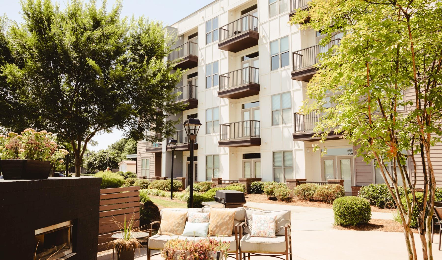 a building with a patio and chairs